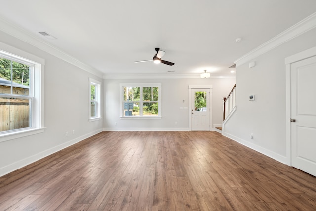 unfurnished living room with crown molding, dark hardwood / wood-style flooring, and ceiling fan