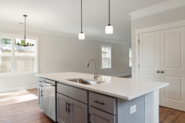 kitchen featuring gray cabinetry, dishwasher, sink, an island with sink, and pendant lighting