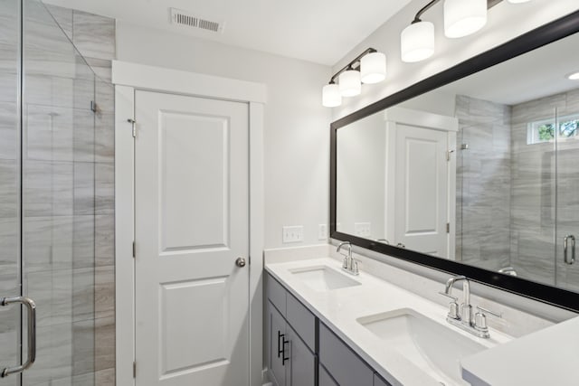 bathroom with vanity and an enclosed shower