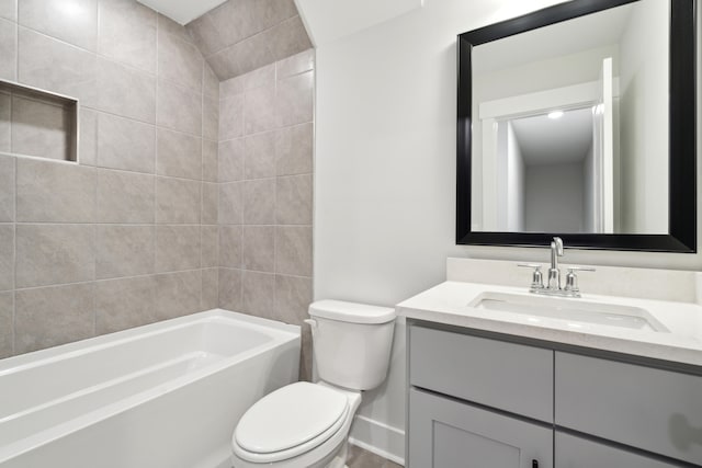 full bathroom featuring vanity, toilet, and washtub / shower combination