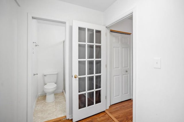 bathroom featuring tile patterned floors and toilet