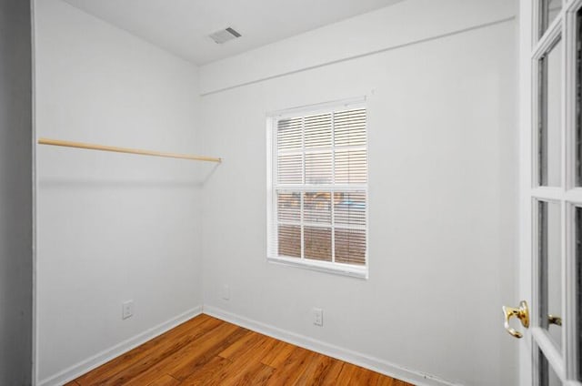 empty room featuring hardwood / wood-style flooring