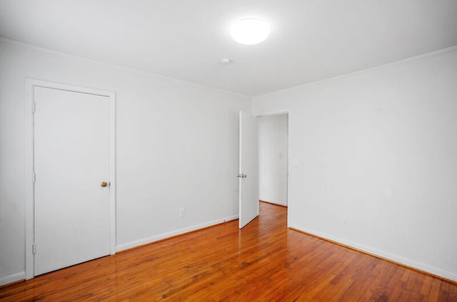 spare room featuring hardwood / wood-style flooring