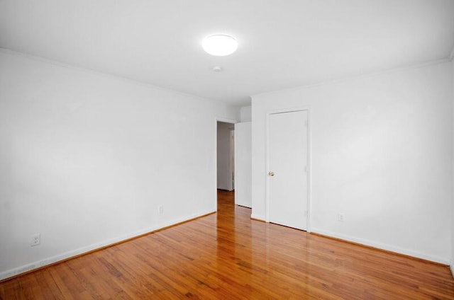 spare room featuring hardwood / wood-style flooring