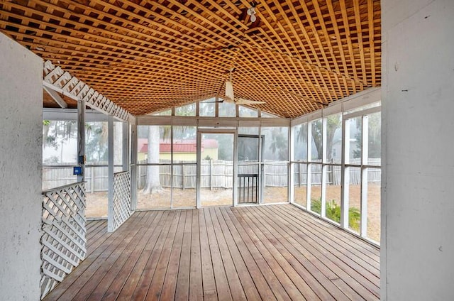 unfurnished sunroom with lofted ceiling