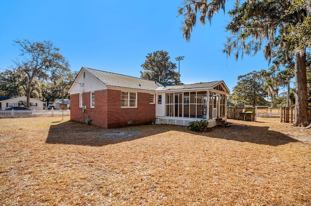 back of property featuring a sunroom