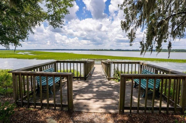 wooden terrace with a water view