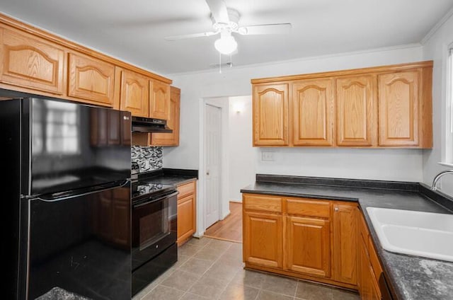 kitchen with sink, ceiling fan, black appliances, light tile patterned flooring, and decorative backsplash