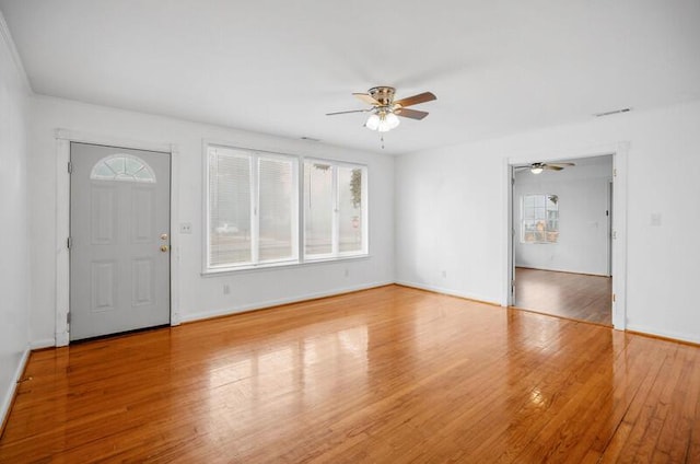 interior space featuring hardwood / wood-style floors and ceiling fan