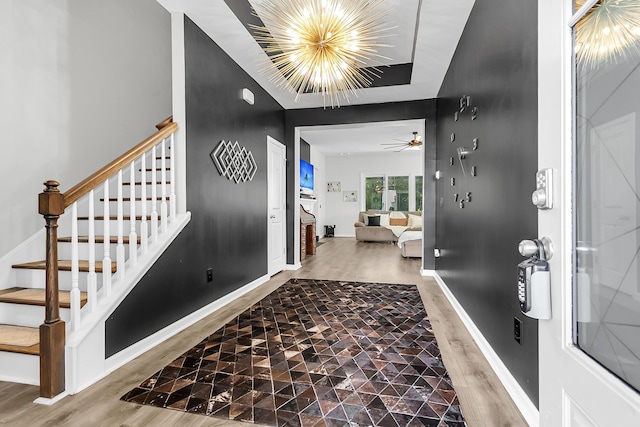 foyer featuring hardwood / wood-style floors and a notable chandelier