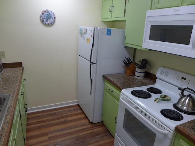 kitchen with green cabinets, dark hardwood / wood-style flooring, and white appliances