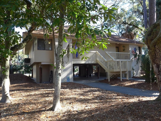 back of property with a carport