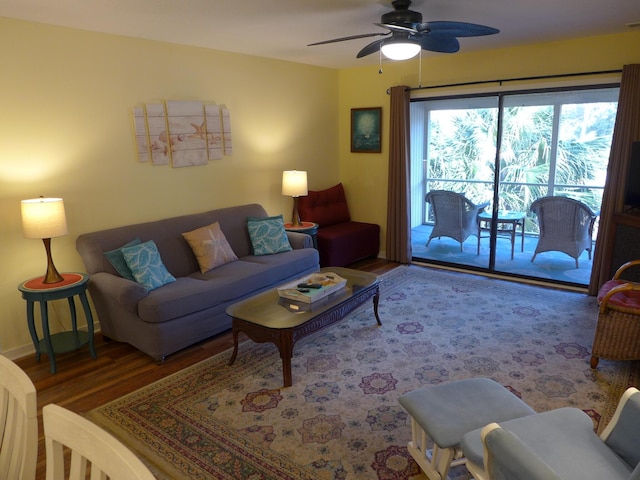 living room featuring hardwood / wood-style flooring and ceiling fan