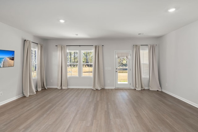 spare room featuring light hardwood / wood-style flooring