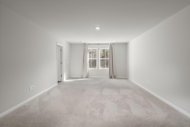 spare room with light colored carpet