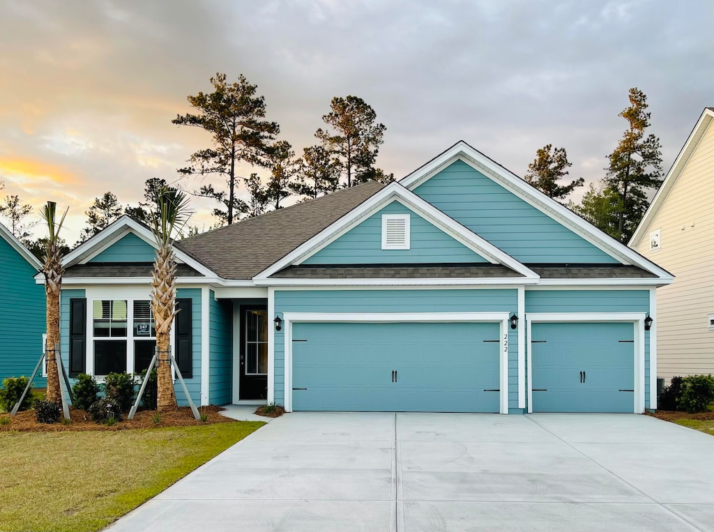 craftsman-style home with a yard