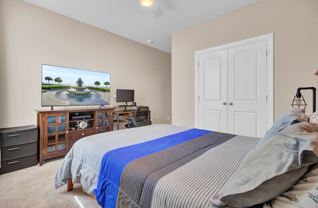 bedroom with carpet floors, ceiling fan, and a closet