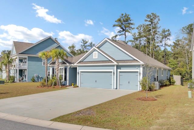 view of front of home featuring a balcony, a front yard, and central AC