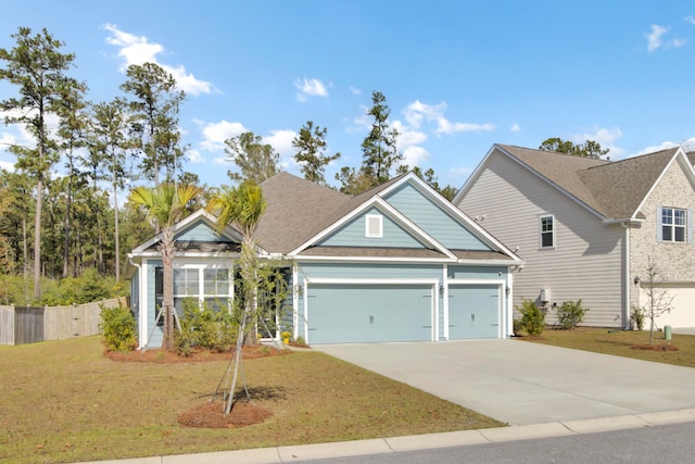 view of front facade with a garage and a front yard