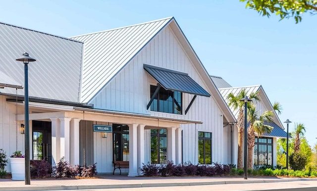 305 Archar St, Summerville, SC 29486 - view of front of property with a standing seam roof, a metal roof, board and batten siding, and a porch