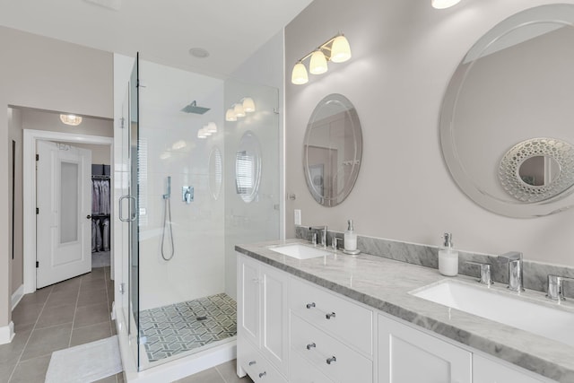656 Coleman Blvd Unit 703, Mount Pleasant, SC 29464 - bathroom with a shower stall, tile patterned floors, double vanity, and baseboards