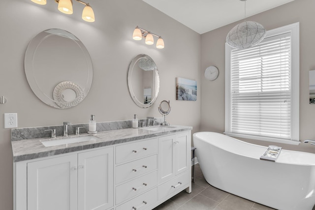 656 Coleman Blvd Unit 703, Mount Pleasant, SC 29464 - bathroom featuring double vanity, tile patterned floors, and a freestanding bath