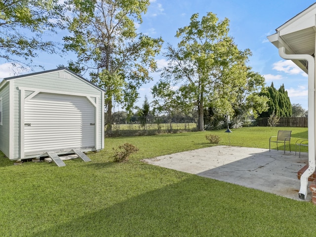 view of yard featuring an outbuilding and a patio