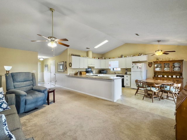 carpeted living room with ceiling fan, sink, and lofted ceiling