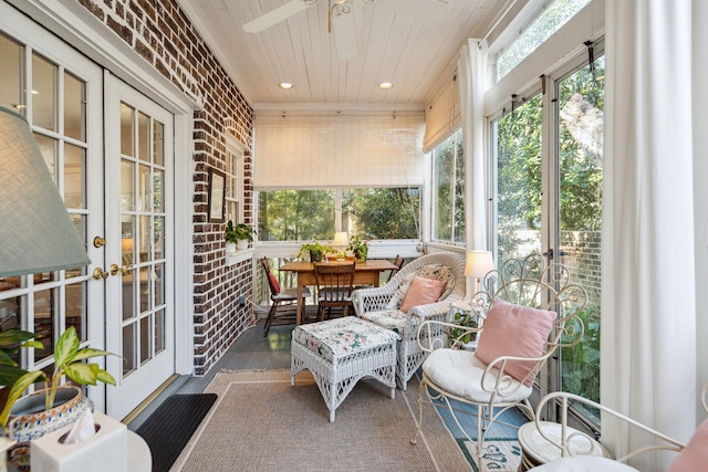 sunroom featuring wood ceiling and french doors