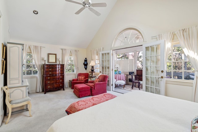 carpeted bedroom featuring high vaulted ceiling, access to exterior, french doors, and a ceiling fan