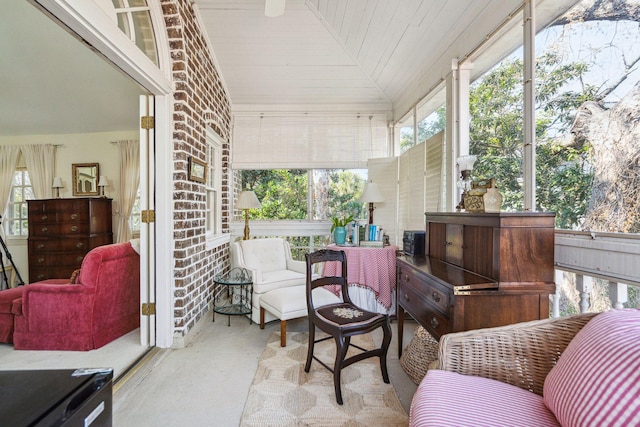 sunroom / solarium featuring lofted ceiling