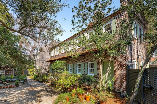 view of property exterior featuring brick siding