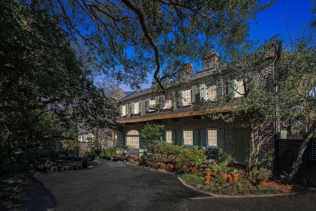 view of front of home with brick siding