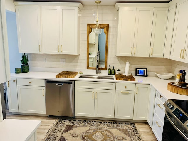 1202 Ventura Pl, Mount Pleasant, SC 29464 - kitchen with light wood finished floors, light countertops, stainless steel appliances, and a sink