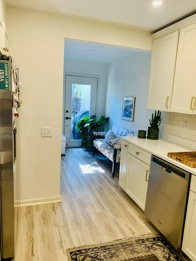 1202 Ventura Pl, Mount Pleasant, SC 29464 - kitchen with recessed lighting, light wood-style flooring, white cabinetry, light countertops, and appliances with stainless steel finishes