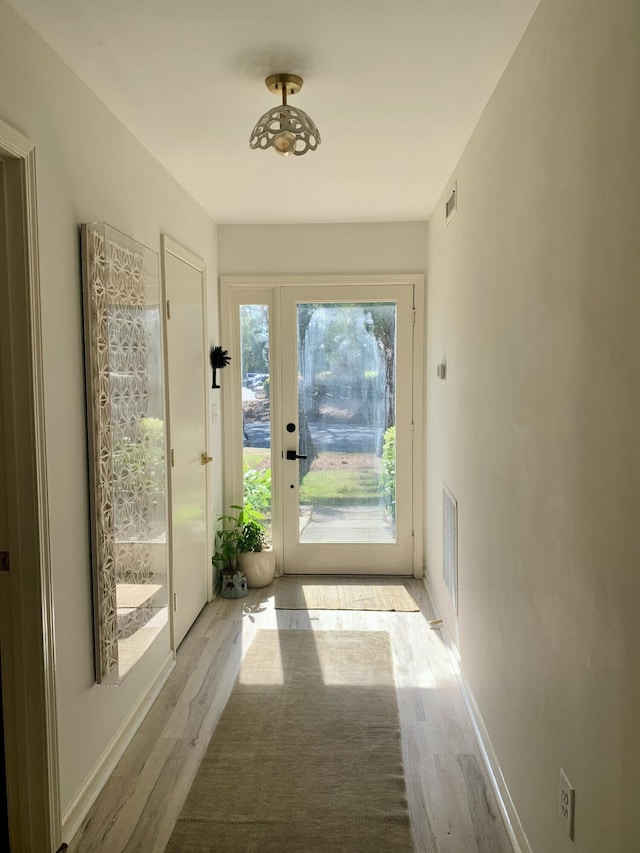 1202 Ventura Pl, Mount Pleasant, SC 29464 - doorway with baseboards, light wood-style floors, and visible vents