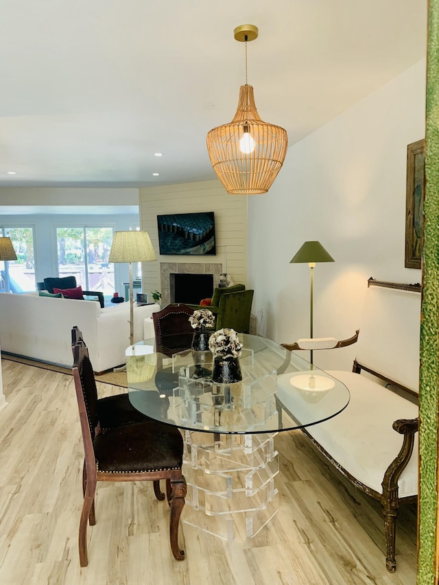 1202 Ventura Pl, Mount Pleasant, SC 29464 - dining space with a fireplace and wood finished floors