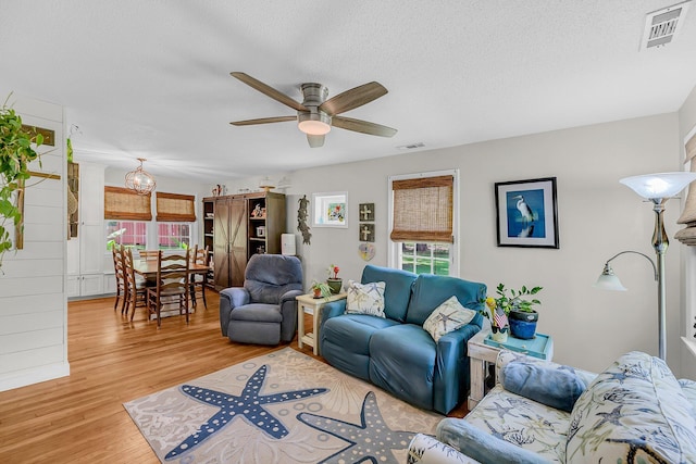 7274 Commodore Rd, Hollywood, SC 29449 - living area featuring a ceiling fan, light wood-type flooring, and a textured ceiling
