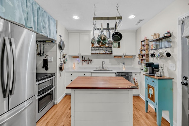 7274 Commodore Rd, Hollywood, SC 29449 - kitchen with stainless steel appliances, butcher block countertops, light wood finished floors, and recessed lighting