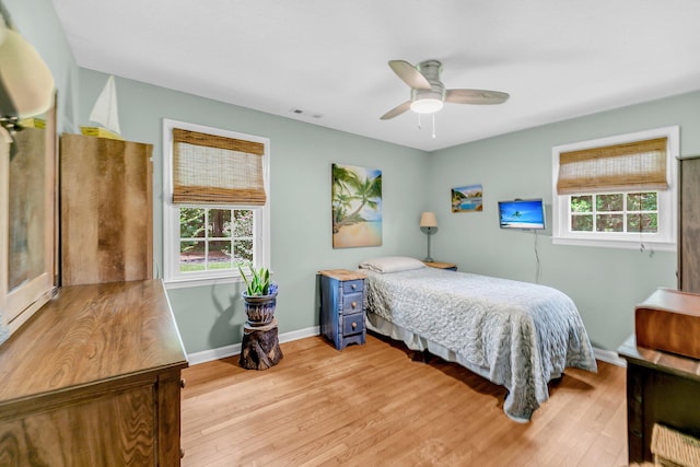 7274 Commodore Rd, Hollywood, SC 29449 - bedroom with multiple windows, light wood finished floors, and a ceiling fan