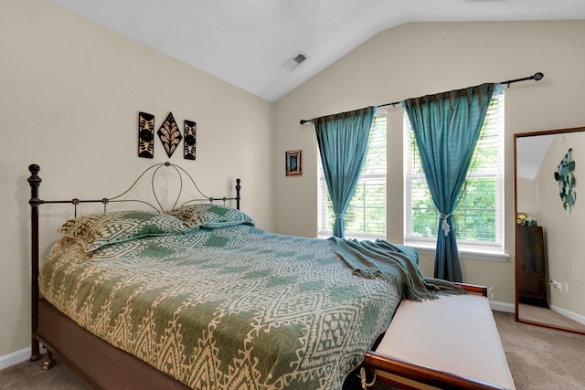 bedroom featuring vaulted ceiling and carpet flooring