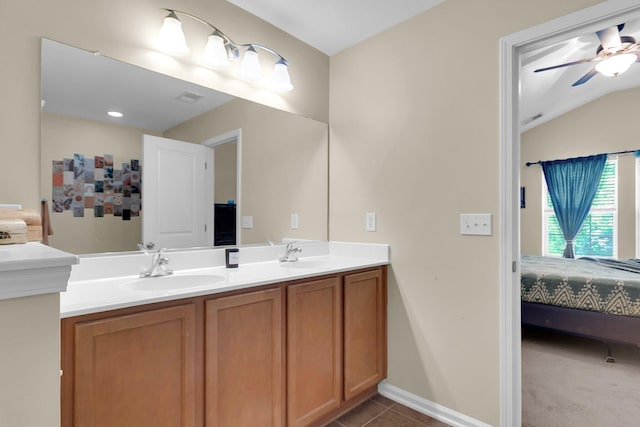 bathroom with tile patterned flooring, vanity, lofted ceiling, and ceiling fan