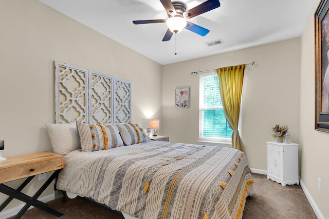 bedroom featuring dark colored carpet and ceiling fan