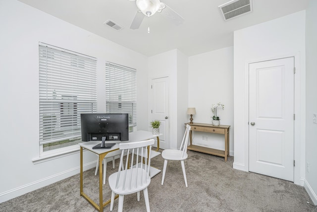 office area featuring ceiling fan and light colored carpet