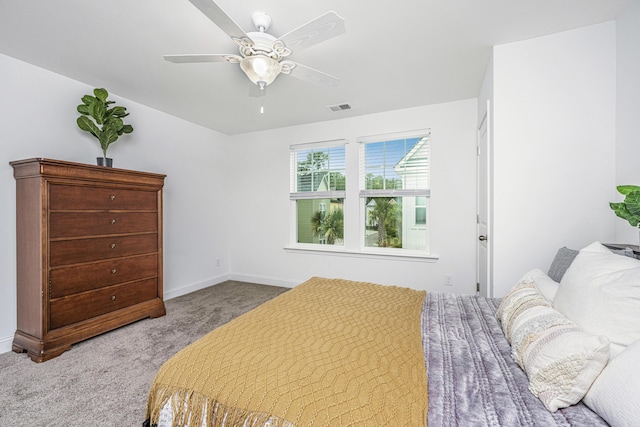 bedroom featuring ceiling fan and light carpet