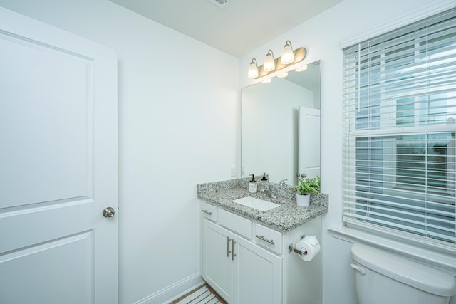 bathroom with vanity and toilet