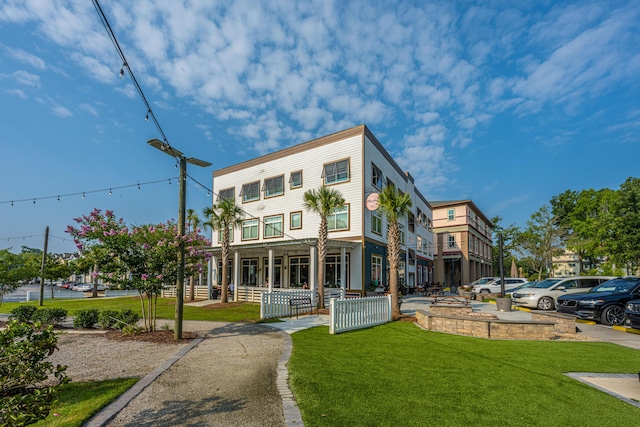 view of front of house featuring a front yard and covered porch