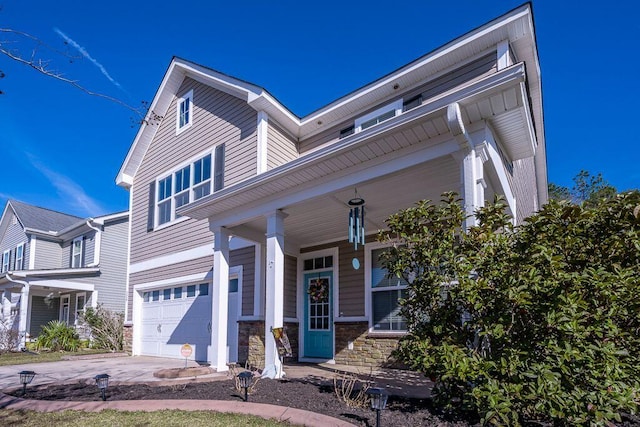 view of front of home featuring a garage and covered porch