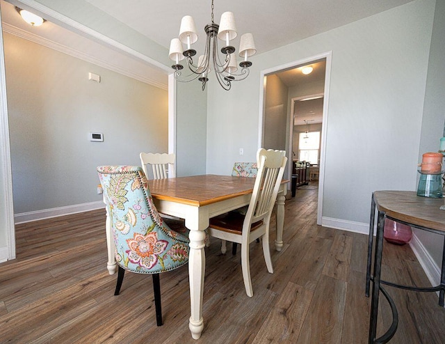 dining room with a notable chandelier and dark wood-type flooring