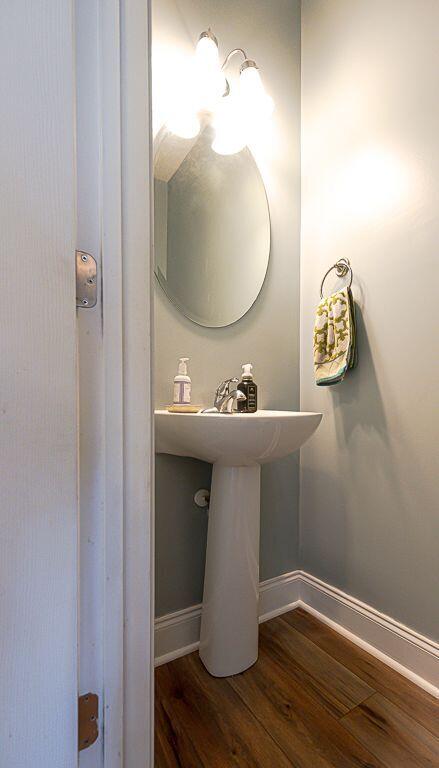 bathroom with wood-type flooring